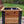 Cedar garden planter box with black corner posts and flowers